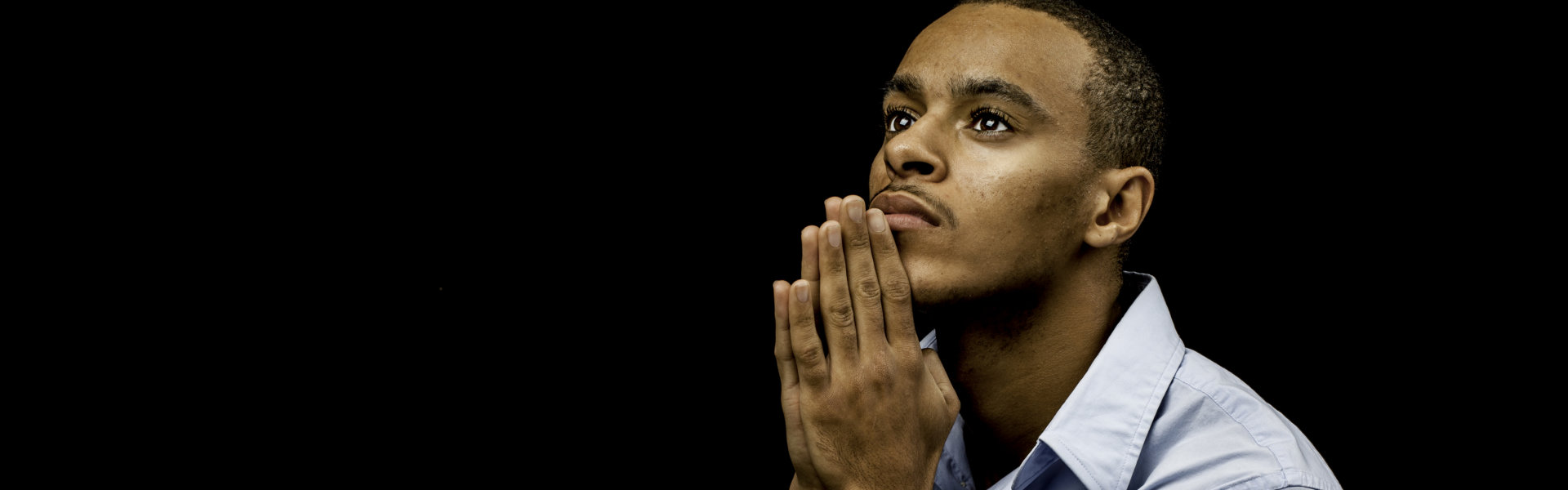 male praying with plenty of space